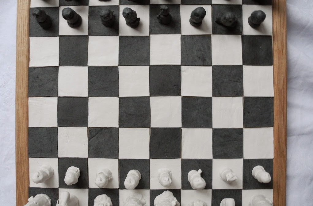 Chess board with owls in black and white porcelain